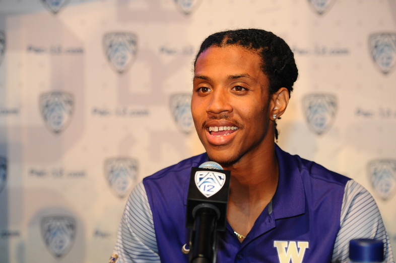Washington defensive back Kevin King laughs it up with the media at the podium. 