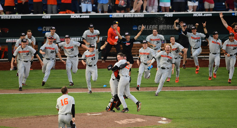 Oregon State baseball rushes the mound moments after Kevin Abel pitched a shutout vs. Arkansas in Game 3 to claim the program's third College World Series trophy.