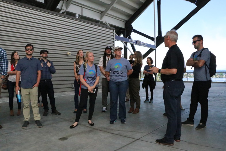 Chip Lydum, Associate Athletic Director for Washington, leads a sustainability tour of Husky Stadium on Tuesday.