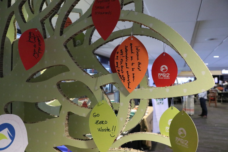 Attendees wrote sustainability pledges and goals on the Pac-12 Team Green tree near the main entrance. 