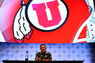 Utah head coach Kyle Whittingham looks on from the podium. 