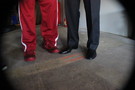 <p>USC senior guard J.T. Terrell's (left) Nike kicks and head coach Andy Enfield's (right) dress shoes.</p>
