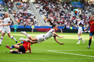 USA's Kelley O'Hara is tackled by Spain's Irene Paredes (bottom) Spain v United States - FIFA Women's World Cup 2019 - Round of 16 - Stade Auguste-Delaune II. June 24, 2019. 