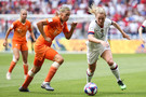 Samantha Mewis of USA competes for the ball with #6 Anouk Dekker of Netherlandsduring the 2019 FIFA Women's World Cup France Final match between The United State of America and The Netherlands at Stade de Lyon on July 07, 2019 in Lyon, France.